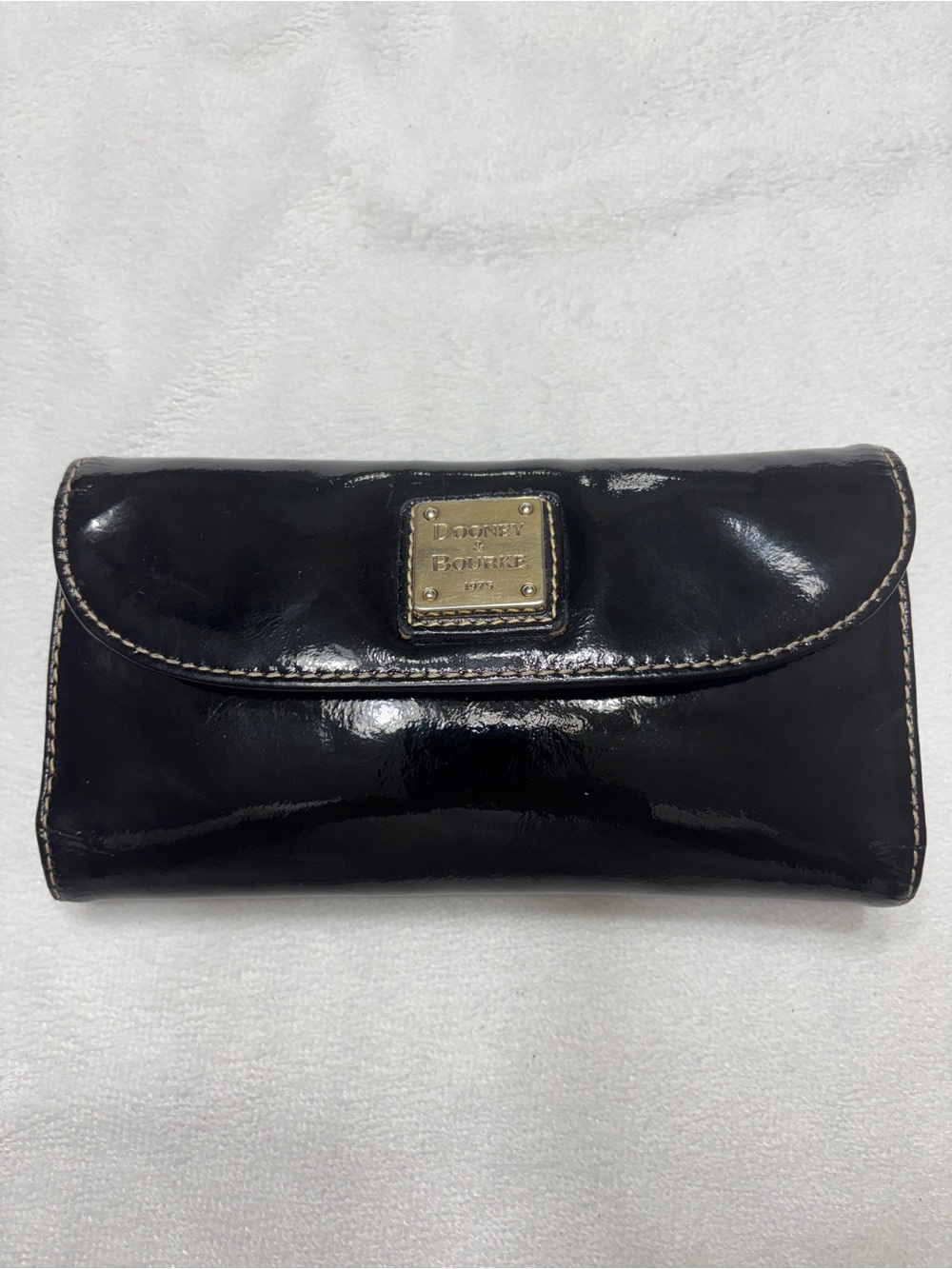 Dooney & Bourke Black Patent Leather Flap Wallet with Gold Plaque Logo